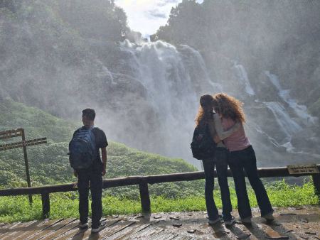 Guests taking in the spray of the waterfall - lifeonwheel.com