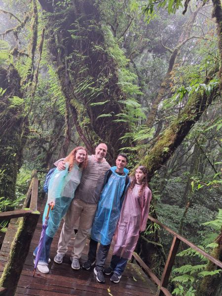 Ponchos on for a rainy walk in the cloud forest - lifeonwheel.com