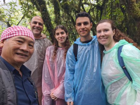 Our guide with the family under the moss-covered canopy - lifeonwheel.com