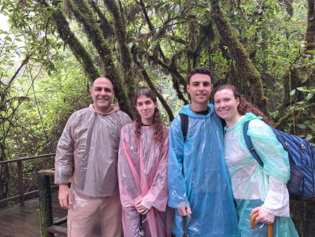The family gathered beneath a tunnel of mossy branches - lifeonwheel.com