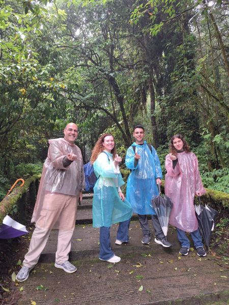 Pointing at the camera on the misty forest steps - lifeonwheel.com