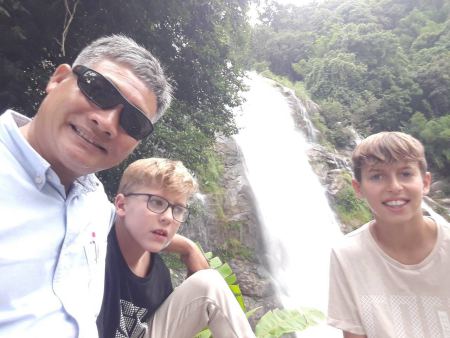 Our guide with two boys resting by the falls - lifeonwheel.com