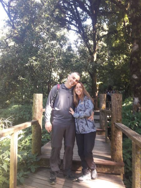 A couple on the forest bridge on the summit trail - lifeonwheel.com