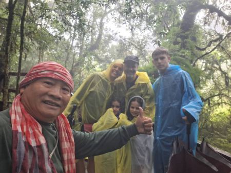 Our guide with the family in yellow rain ponchos - lifeonwheel.com