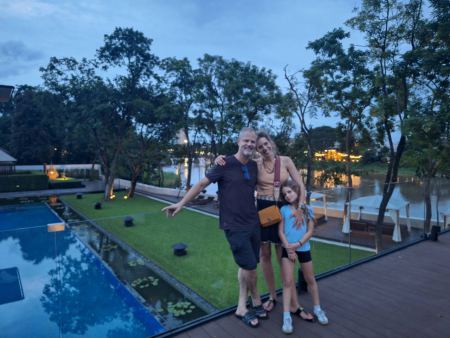 An evening family photo by the hotel pool - lifeonwheel.com