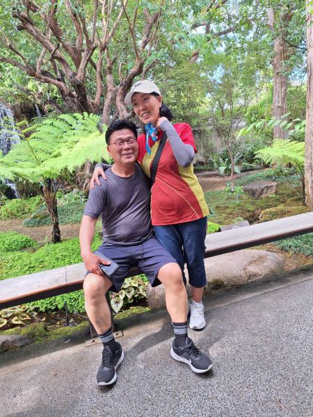 A couple by the fern garden waterfall - lifeonwheel.com