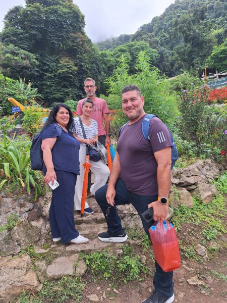 A group pausing on the garden steps in the rain - lifeonwheel.com