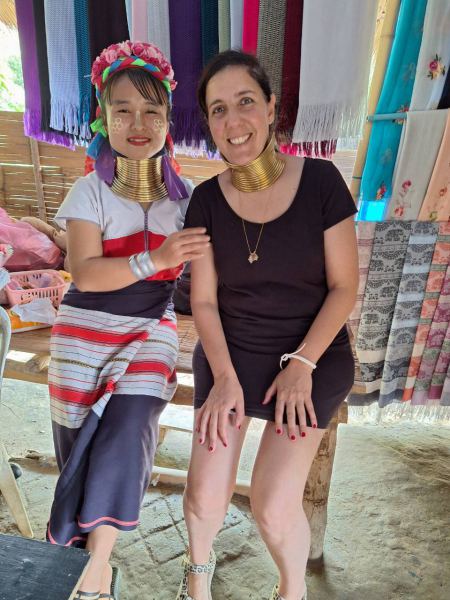 A guest trying the brass neck rings with her Karen host - lifeonwheel.com