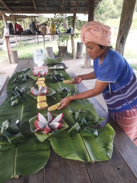 A village cook laying out lunch on banana leaves - lifeonwheel.com