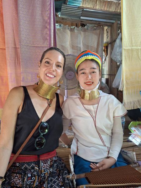 A guest wearing the neck rings beside her host - lifeonwheel.com