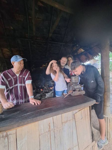 Watching coffee being ground in the village kitchen - lifeonwheel.com