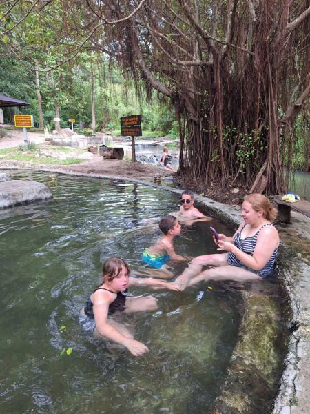 Soaking in the hot spring pool beneath the banyan roots - lifeonwheel.com