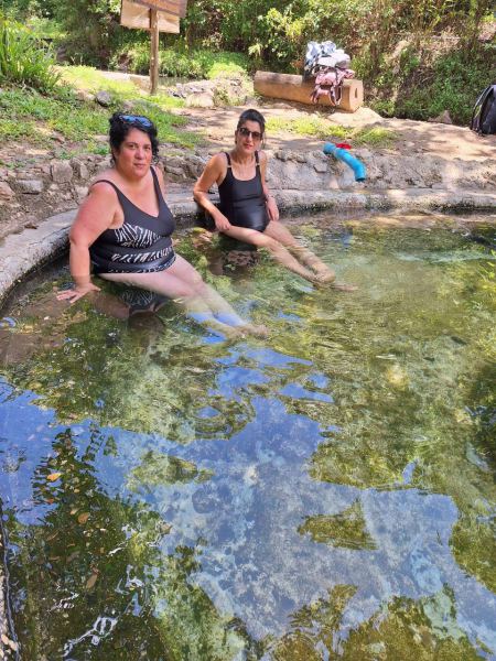Feet in the warm spring water on a shaded afternoon - lifeonwheel.com