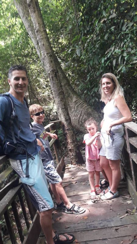 A family on the boardwalk through the forest - lifeonwheel.com