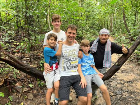 Family and guide together on the forest path - lifeonwheel.com