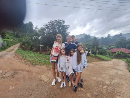 A family at the crossroads of a hillside village - lifeonwheel.com