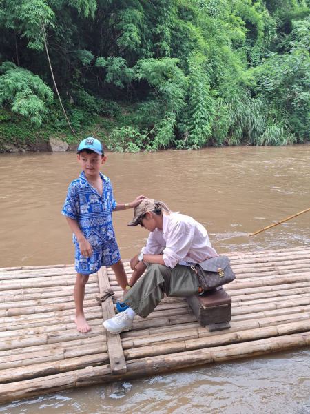 Waiting to board the bamboo raft on the muddy river - lifeonwheel.com