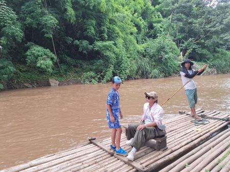 Guests seated on the bamboo raft as it sets off - lifeonwheel.com