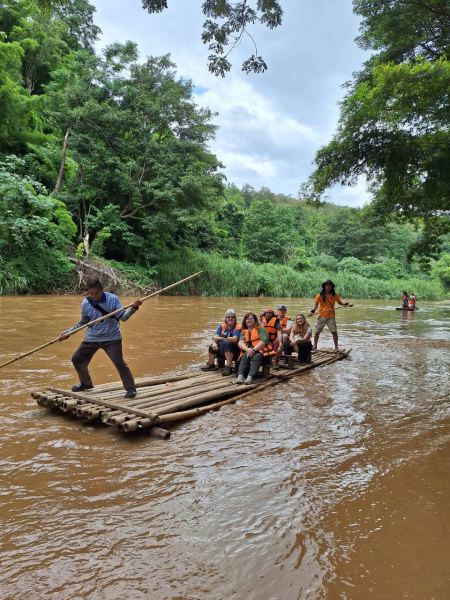 A full raft of guests being poled downstream - lifeonwheel.com