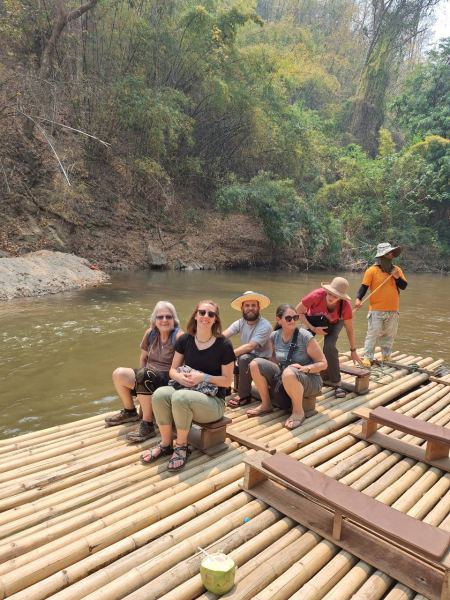 Guests seated on the bamboo raft, ready to depart - lifeonwheel.com