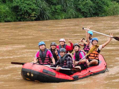 Paddles raised in celebration after the rapids - lifeonwheel.com