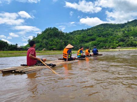 Our guide poling the raft toward the far shore - lifeonwheel.com