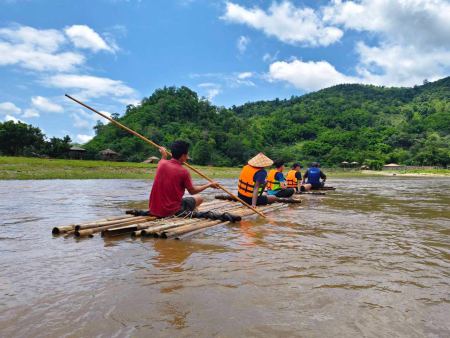 Heading out across open water on the bamboo raft - lifeonwheel.com