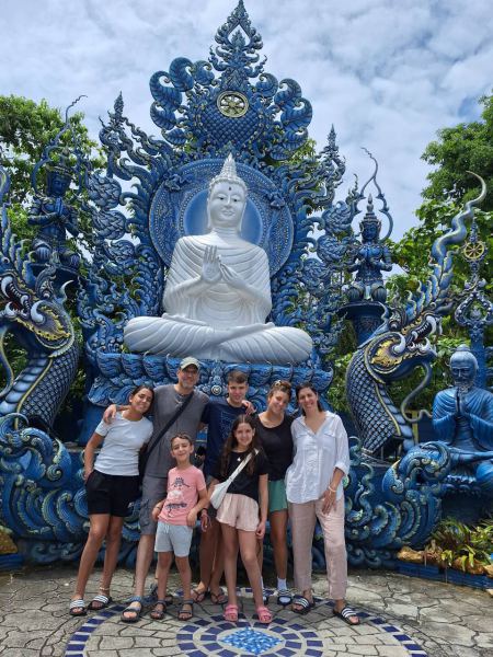 Family photo before the white Buddha at the Blue Temple - lifeonwheel.com