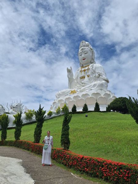 The great white Guanyin statue overlooking the hills - lifeonwheel.com