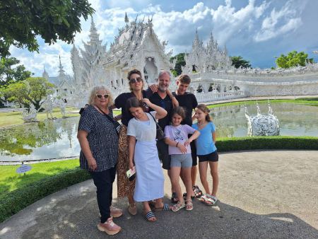 A family group in front of the White Temple's reflecting pool - lifeonwheel.com