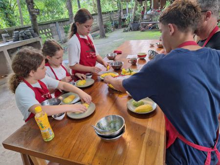 Slicing mango together around the kitchen table - lifeonwheel.com