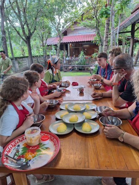 The class gathered round the table with their mango plates - lifeonwheel.com