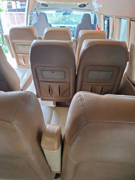 Looking down the aisle of reclining leather seats - lifeonwheel.com