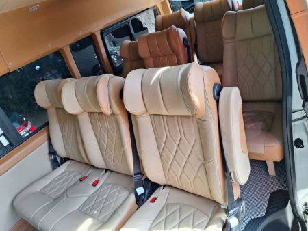 Tan leather captain's chairs in the newer van - lifeonwheel.com