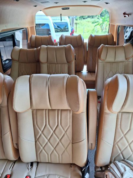 Rows of quilted leather seats seen from the back - lifeonwheel.com
