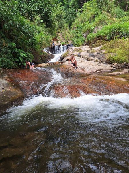 Cooling off on the sun-warmed rocks below the falls - lifeonwheel.com