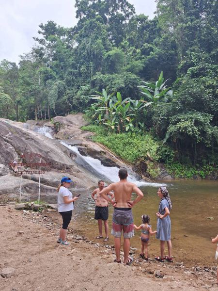 The family gathered at the edge of the jungle pool - lifeonwheel.com