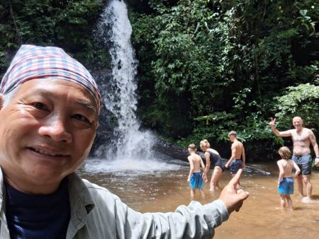 Our guide with guests enjoying the waterfall pool - lifeonwheel.com