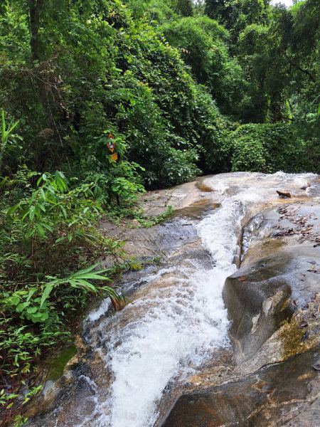 Water rushing over the smooth granite rock - lifeonwheel.com