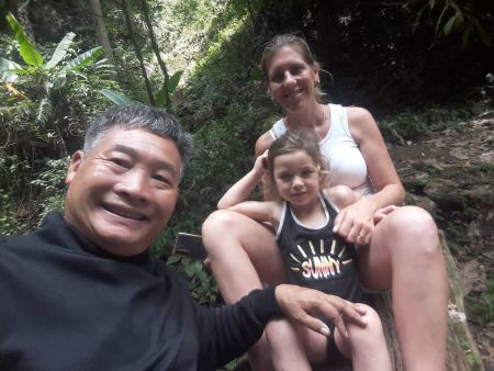 Our guide with a family beside the shaded stream - lifeonwheel.com