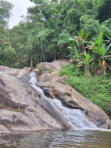 Water sliding smoothly down the granite rock face - lifeonwheel.com