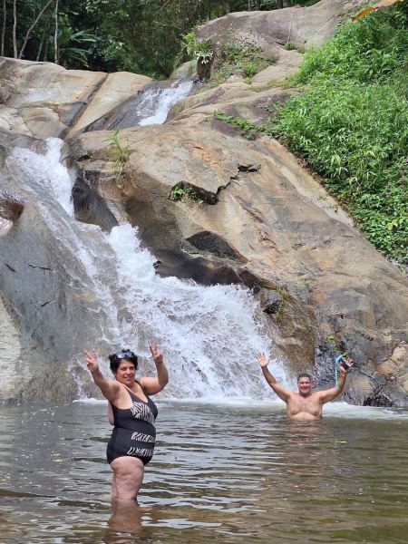 Guests waving from the base of the small falls - lifeonwheel.com